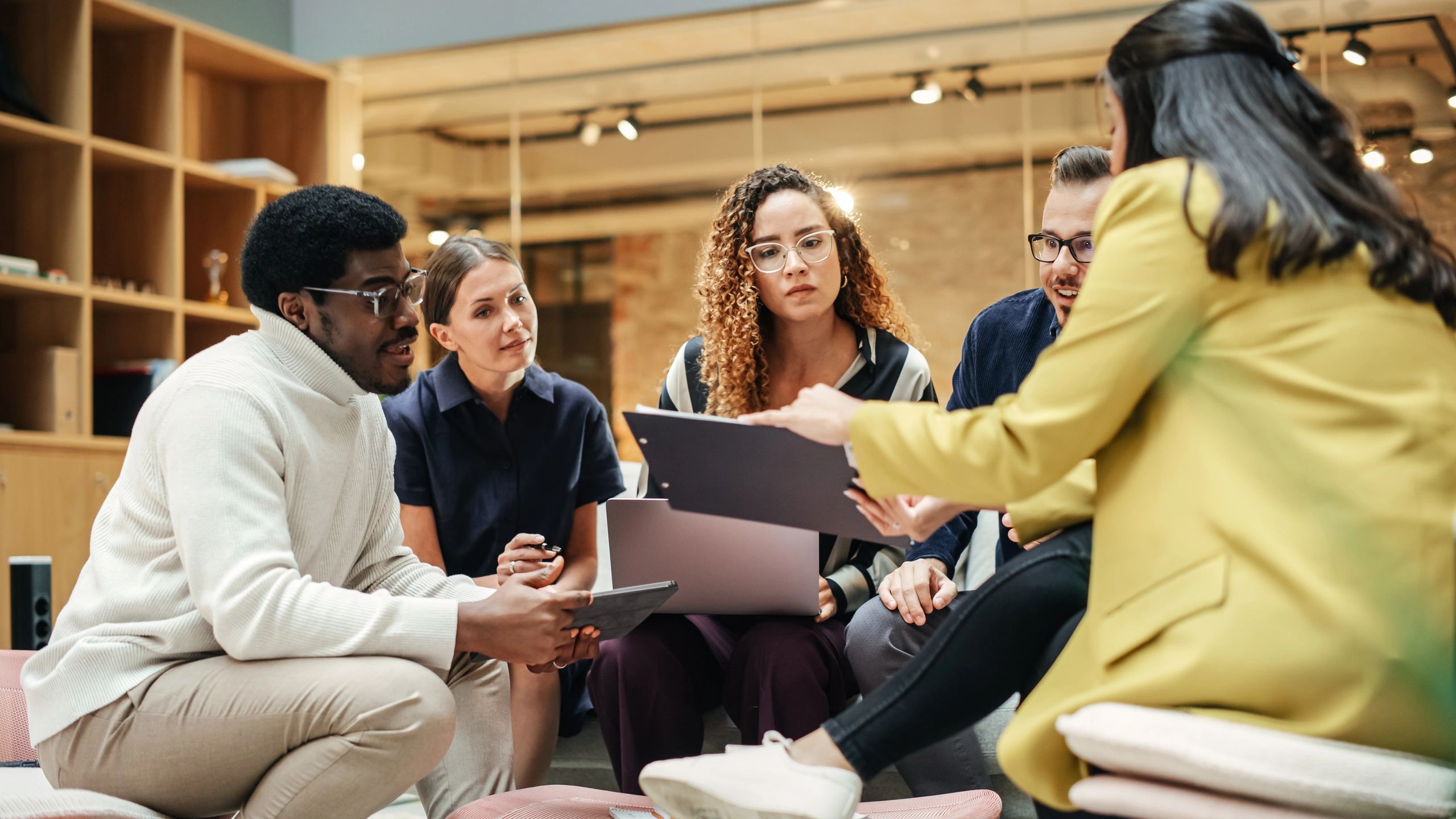 Team collaborating on hiring strategy in a modern office