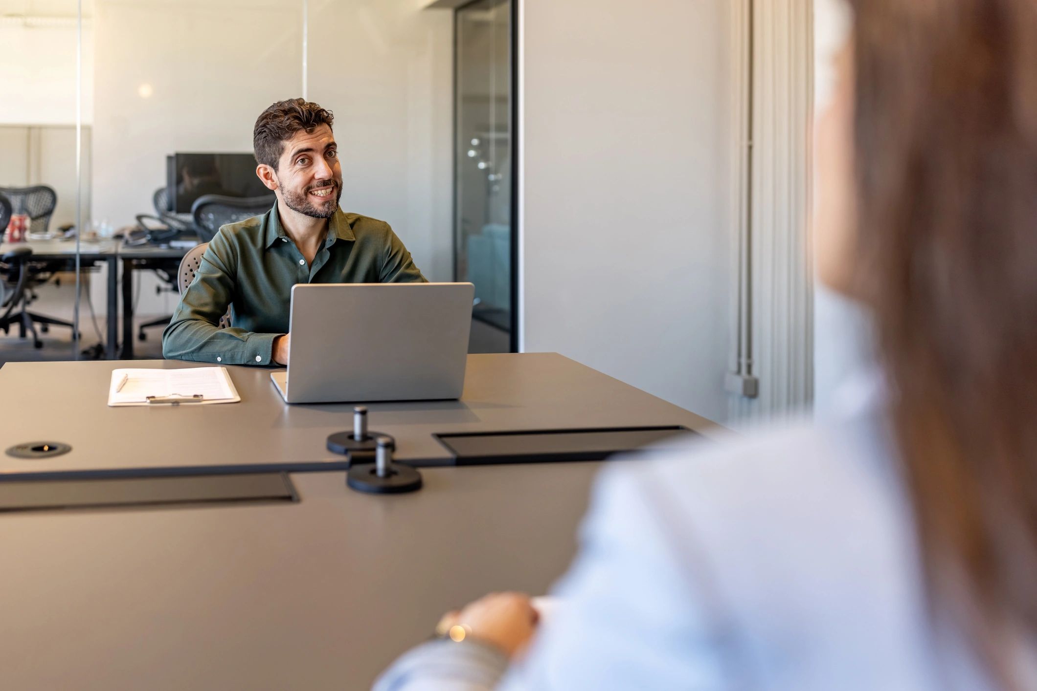 Professional consultant speaking across a conference table